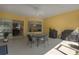 This patio with a ceiling fan features an outdoor seating and grilling area at 3312 92Nd E Ave, Parrish, FL 34219