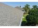 New roof on a home with lush landscaping and well-maintained lawn at 3312 92Nd E Ave, Parrish, FL 34219