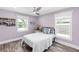 Quaint bedroom featuring wood floors, a ceiling fan, and natural light at 3417 50Th W St, Bradenton, FL 34209