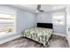 Stylish bedroom with hardwood floors, ceiling fan, and bright windows at 3417 50Th W St, Bradenton, FL 34209