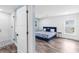 Well lit bedroom with blue accents, decorative ceiling fan, and updated en suite bathroom at 3417 50Th W St, Bradenton, FL 34209