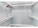 Bright, open closet with a simple white shelving system and light blue walls at 3417 50Th W St, Bradenton, FL 34209