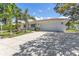 Well-maintained home with a two-car garage, manicured lawn, and sunny skies at 3417 50Th W St, Bradenton, FL 34209