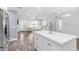 Spacious living area connects seamlessly with a well-appointed kitchen with bar seating at 3417 50Th W St, Bradenton, FL 34209