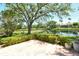 Scenic backyard with a pond and lush greenery, perfect for relaxation at 3870 Alamanda Dr, Sarasota, FL 34238