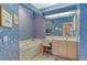 Well-lit bathroom featuring vanity area and soaking tub at 3870 Alamanda Dr, Sarasota, FL 34238