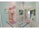 Charming dining area with tile floors, glass table, and easy access to the kitchen at 3870 Alamanda Dr, Sarasota, FL 34238