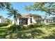 Beautiful exterior showcasing lush landscaping, a well-maintained lawn, and a serene setting at 3870 Alamanda Dr, Sarasota, FL 34238