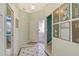 Inviting foyer featuring stylish tile flooring and access to various rooms, offering a glimpse of the home's layout at 3870 Alamanda Dr, Sarasota, FL 34238