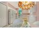 Bright kitchen features an island, appliances, and eat-in breakfast nook at 3870 Alamanda Dr, Sarasota, FL 34238