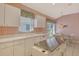 Bright kitchen features an island, appliances, and eat-in breakfast nook at 3870 Alamanda Dr, Sarasota, FL 34238