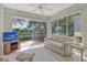 Relaxing lanai with tile floors, comfortable seating, and a scenic view of the backyard lake at 3870 Alamanda Dr, Sarasota, FL 34238