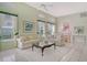 Bright living room showcasing neutral colors, an open layout, and views of the dining area at 3870 Alamanda Dr, Sarasota, FL 34238