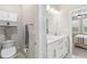 Bathroom featuring a toilet, vanity with dual sinks, and a shower behind the door at 412 Daylily Blvd, Nokomis, FL 34275