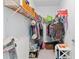Walk-in closet with wire shelving, hanging clothes, and storage bins for ample storage space at 412 Daylily Blvd, Nokomis, FL 34275