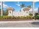 Elegant Venice Woodlands community entrance sign with lush landscaping at 412 Daylily Blvd, Nokomis, FL 34275