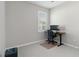 Bright office space with a modern desk, large window, and neutral carpet at 412 Daylily Blvd, Nokomis, FL 34275