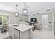 Spacious open-concept living area combining the kitchen, dining, and living spaces for a seamless lifestyle at 412 Daylily Blvd, Nokomis, FL 34275