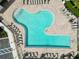 Aerial view of community swimming pool featuring sun loungers and tables at 412 Daylily Blvd, Nokomis, FL 34275