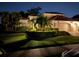 Elegant home with meticulously manicured landscaping and a charming tile roof at twilight at 4668 Tuscana Dr, Sarasota, FL 34241