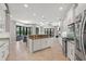 Modern kitchen with stainless steel appliances and ample counter space, adjacent to a dining area with pool views at 4668 Tuscana Dr, Sarasota, FL 34241