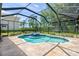 Enclosed pool and hot tub in backyard with covered patio, perfect for outdoor entertainment at 4668 Tuscana Dr, Sarasota, FL 34241
