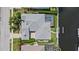 Aerial view of the property featuring a pool and canal access with a boat dock; prime waterfront living at 4715 Spinnaker Dr, Bradenton, FL 34208
