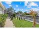 Backyard canal view features a private dock and lush landscaping, perfect for enjoying waterfront living at 4715 Spinnaker Dr, Bradenton, FL 34208