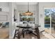 Cozy dining area with modern table setting and views of the outdoor pool area at 4715 Spinnaker Dr, Bradenton, FL 34208