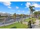Scenic view of a canal with boat dock, lush greenery, and waterfront homes offering a serene coastal lifestyle at 4715 Spinnaker Dr, Bradenton, FL 34208