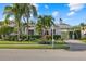 Charming home with lush landscaping, mature palm trees and meticulous landscaping, offers great curb appeal at 4715 Spinnaker Dr, Bradenton, FL 34208