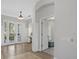 Elegant foyer with hardwood floors, decorative columns, and an open layout that invites you in at 4715 Spinnaker Dr, Bradenton, FL 34208