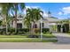 Charming one-story home with well-manicured lawn, lush landscaping, and a welcoming entrance at 4715 Spinnaker Dr, Bradenton, FL 34208