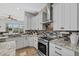 Modern kitchen with custom cabinets, granite countertops, and stainless steel appliances at 4715 Spinnaker Dr, Bradenton, FL 34208
