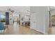 Spacious living area leads to dining area and includes hardwood floors and a hall closet at 4715 Spinnaker Dr, Bradenton, FL 34208