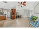 Open-concept living space featuring a kitchen, dining area with modern lighting, and stylish furniture at 4715 Spinnaker Dr, Bradenton, FL 34208