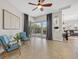 Open-concept living room with cozy seating area and views of the backyard pool at 4715 Spinnaker Dr, Bradenton, FL 34208