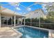 Lovely screened-in pool with brick patio, ideal for relaxation and outdoor enjoyment at 4715 Spinnaker Dr, Bradenton, FL 34208