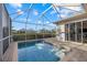 Tranquil screened-in pool featuring a brick patio offers a refreshing outdoor space at 4715 Spinnaker Dr, Bradenton, FL 34208