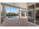 Spacious screened-in pool area with a brick patio offers views of neighboring houses at 4715 Spinnaker Dr, Bradenton, FL 34208