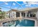 Expansive screened-in pool area with brick patio and access to multiple living spaces at 4715 Spinnaker Dr, Bradenton, FL 34208