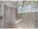 Modern walk-in shower featuring stylish tile and a window at 4715 Spinnaker Dr, Bradenton, FL 34208