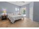 Spacious bedroom with access to the pool area and neutral tile flooring at 4729 Peridia E Blvd, Bradenton, FL 34203