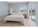 Neutral bedroom featuring a sliding glass door offering backyard and pool views at 4729 Peridia E Blvd, Bradenton, FL 34203