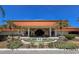 Impressive clubhouse entrance with a fountain and manicured landscaping at 4729 Peridia E Blvd, Bradenton, FL 34203