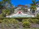 Peridia Golf & Country Club sign surrounded by lush, mature landscaping at 4729 Peridia E Blvd, Bradenton, FL 34203