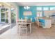 Bright dining area with sliding glass doors to the lanai and backyard at 4729 Peridia E Blvd, Bradenton, FL 34203