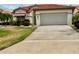 Charming single-story home with a two-car garage and a beautiful terracotta roof at 4729 Peridia E Blvd, Bradenton, FL 34203