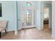 Inviting foyer with decorative glass front door and ceramic tile flooring at 4729 Peridia E Blvd, Bradenton, FL 34203
