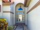 Stylish front door with decorative glass and transom window at 4729 Peridia E Blvd, Bradenton, FL 34203